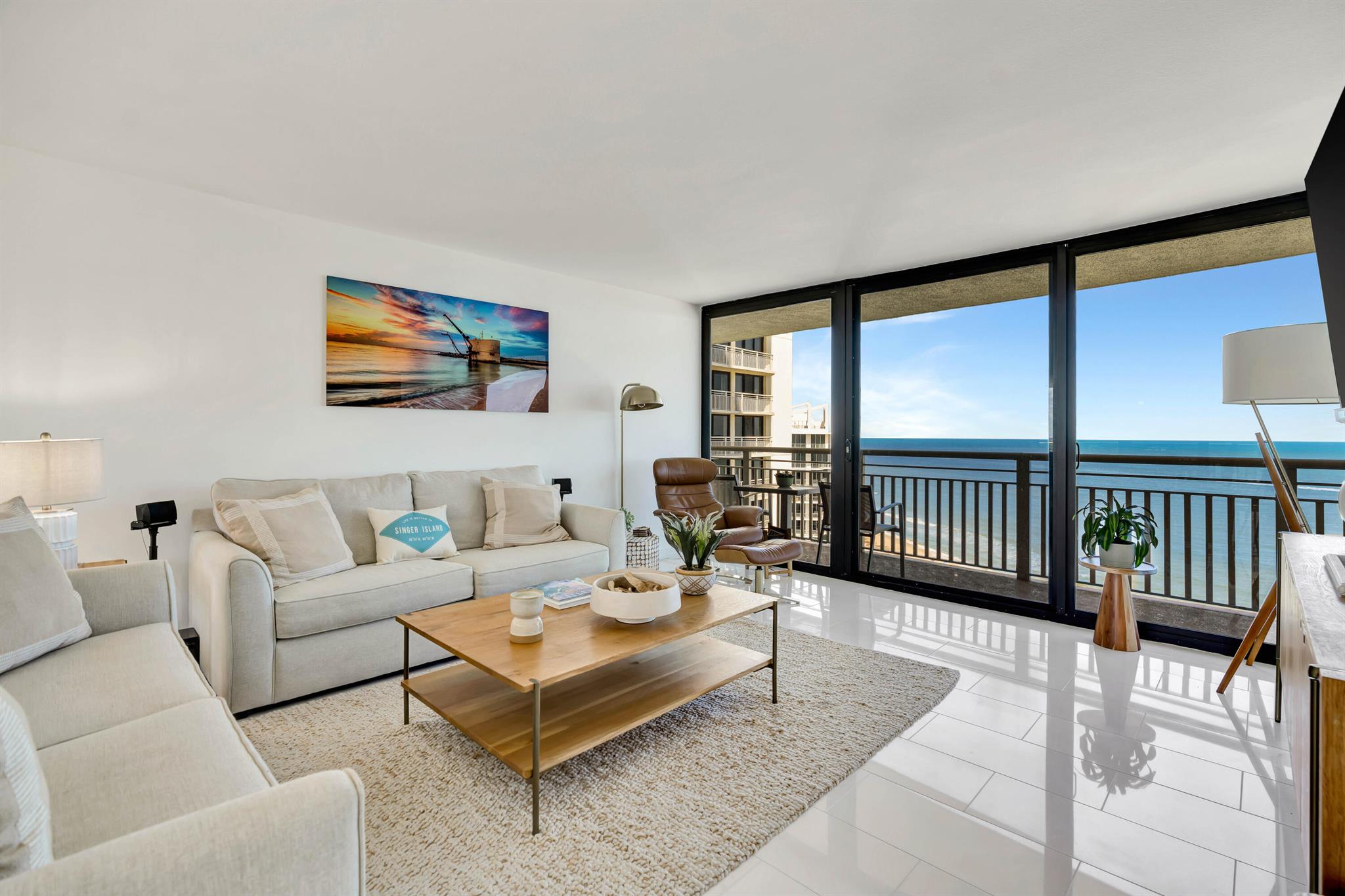 Experience unparalleled luxury at the coveted F-line in Tiara, Singer Island's premier beachfront treasure, making season unforgettable. Unit 24F is a fully renovated 2-bed, 2-bath masterpiece with stunning ocean and Intracoastal views. Enter to sleek floors and designer finishes that reflect elegance and style, all in over 1,500 sq.ft. of exquisite living space. Natural light floods in through floor-to-ceiling impact glass sliders, highlighting custom cabinetry and high-end appliances. The expansive balcony invites you to unwind in paradise. Enjoy resort-style amenities: dining at The Marquis rooftop, a private beach, fitness center, heated pool,and dedicated concierge. Minutes from shopping and Palm Beach luxury. Make this your seasonal home today!
