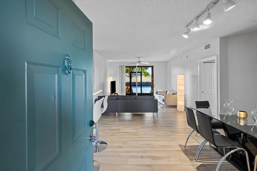 A great opportunity to own this beautiful three-bedroom, two-bathroom home, showcasing sweeping views of the golf course and canal in one of the most desirable Wellington-area communities. This first-floor condo also includes a garage and a dedicated parking space directly in front.