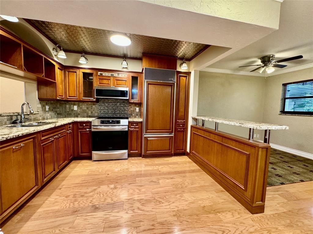 MOTIVATED SELLER! SELLER WILL CONSIDER ALL REASONABLE OFFERS. BEAUTIFUL 2 BEDROOM / 2 BATH SHOWS TRUE PRIDE OF OWNERSHIP! LOCATED ON THE 1ST FLOOR. CUSTOM KITCHEN BOASTS REAL WOOD CABINETS,GRANITE COUNTERTOPS,TIN CEILING,SUB-ZERO REFRIGERATOR/FREEZER,STAINLESS STEEL MICROWAVE & NEWER INDUCTION FLAT TOP RANGE. FULL SIZE WASHER & DRYER. GUEST BATH HAS A FRENCH CLAW FOOT TUB. CUSTOM BUILT IN CLOSET IN 2ND BEDROOM. OVERSIZED FRENCH DOORS. WOOD FLOORS THROUGHOUT LIVING AREAS. KNOCKDOWN CEILINGS. PRIMARY BEDROOM HAS A LARGE CUSTOM CEDAR WALK-IN & LINEN CLOSET
BEFORE ENTERING THE ROOM, PLUS AN ADDITIONAL WALK IN CLOSET. ENCLOSED PATIO WITH POOL & GARDEN
VIEWS. GATED COMMUNITY. BASIC CABLE INCLUDED. NO LEASING. 12 MONTHS OF MAINTENANCE FEES MUST BE HELD IN ESCROW FOR 3 YEARS.