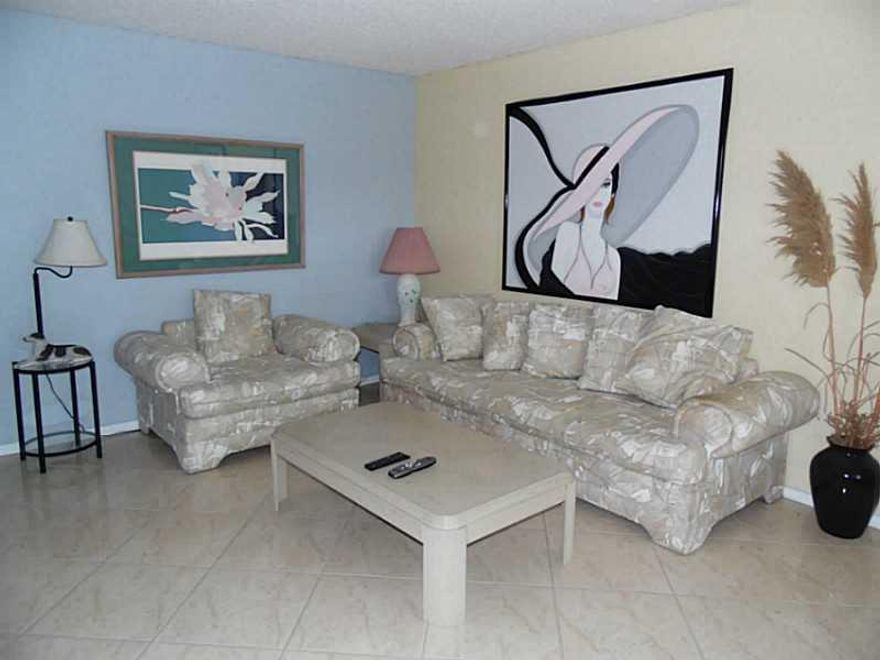 BEAUTIFUL 2 BEDROOM/2 BATH WITH AN AMAZING GARDEN VIEW! LOCATED IN A DESIRABLE LOCATION CLOSE TO CLUBHOUSE! CORNER UNIT FULLY FURNISHED WITH CERAMIC TILE THRU-OUT. CEILING FANS IN ALL ROOMS. ASSOCIATION CLAIMS 55+