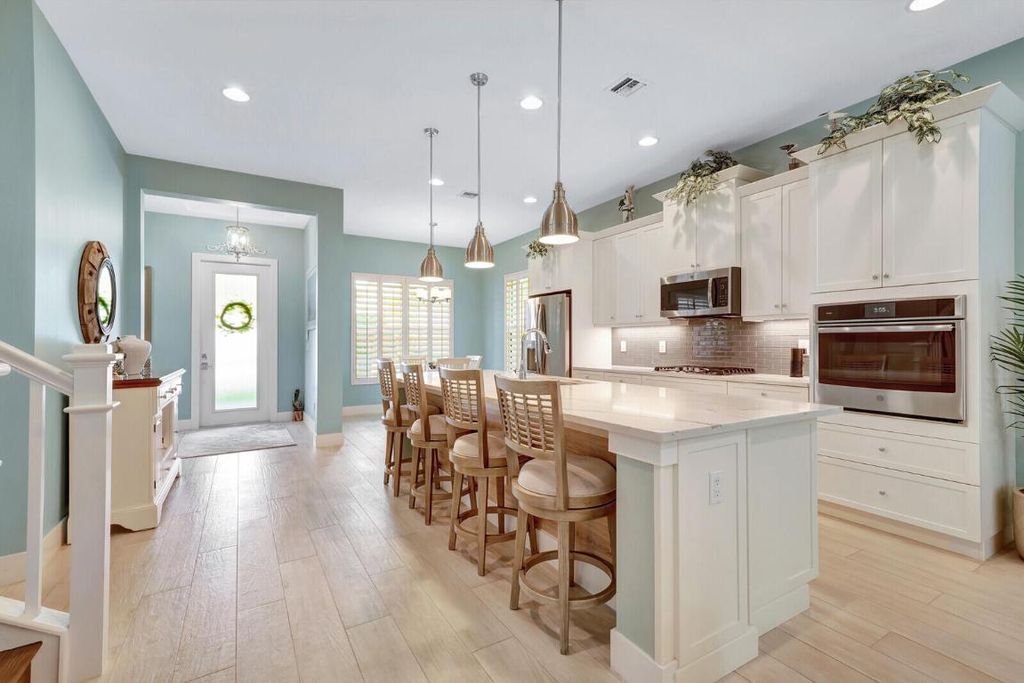 Photo of 1121 Faulkner Terrace, Palm Beach Gardens, FL 33418 (MLS # R10933824)