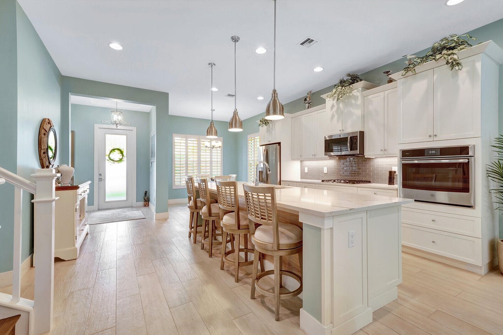 Photo of 1121 Faulkner Terrace, Palm Beach Gardens, FL 33418 (MLS # R10933824)