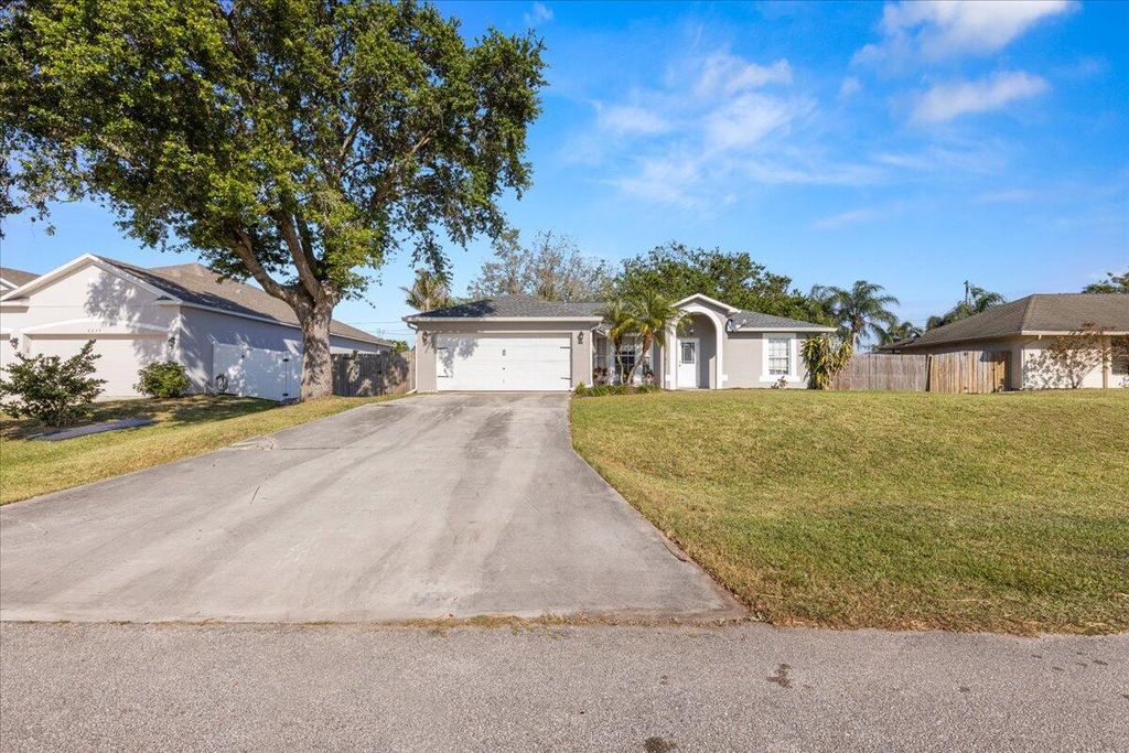 Photo of 4243 SW Utterback Street, Port Saint Lucie, FL 34953 (MLS # R10970626)