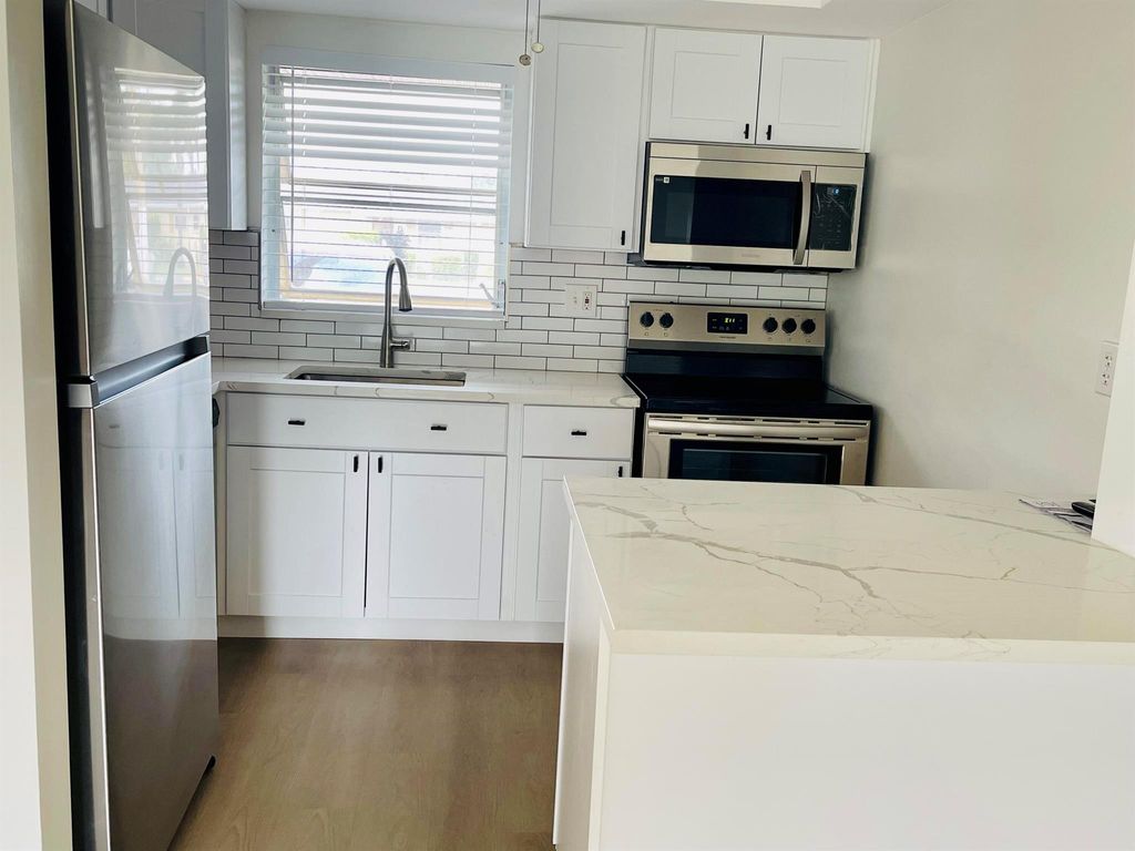 Photo of 2561 Barkley Drive W #B, West Palm Beach, FL 33415 (MLS # R10965047)