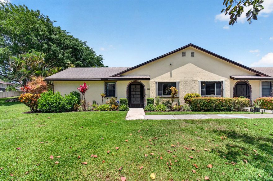 Experience modern luxury in this impeccably renovated corner villa situated in the highly sought-after 55+ community of Lakes of Boca Barwood. This residence has been refined to a model-home standard, featuring high-end craftsmanship and complete peace of mind. The interior boasts a crisp aesthetic with all popcorn ceilings removed and new recessed LED lighting added throughout the primary suite and main living areas. Durable, commercial-grade luxury vinyl planks flow seamlessly into a newer gourmet kitchen, elegantly finished with premium Quartz countertops, custom pull-out pantry drawers, and newer stainless steel appliances.  Both bathrooms have been fully updated with contemporary finishes to match the home's sophisticated style. Major updates provide long-term value,  including a newer roof installed in 2022 and an AC system replaced within the last two years. The exterior features professional wrap-around landscaping on a premium corner lot and an oversized, covered, and screened-in patio that offers excellent privacy. This unit includes the added convenience of assigned covered parking along with a private exterior storage.  The HOA fee provides exceptional value by covering internet, cable, and exterior building insurance. Perfectly positioned for rapid access to the Sawgrass Expressway and major highways, this turnkey home is a rare find. Schedule your private tour today!