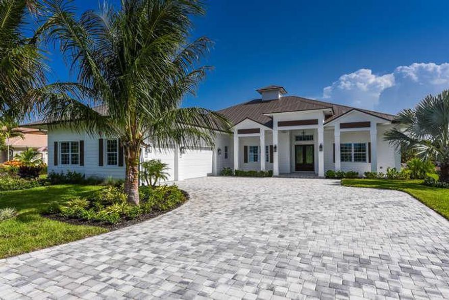 Spectacular CUSTOM Waterfront Home in Popular Windstone. Nestled in Palm City's A-rated school district, you'll find everything you need to enjoy all the perks of a Florida lifestyle. This home features an open floorplan - great for entertaining, gourmet kitchen with ample space for the home chef. Enjoy peace of mind with this quality NEW CONSTRUCTION home featuring one year builder's warranty, stainless steel appliances, modern fixtures with an Old World twist, tile throughout main areas and Master bedroom. Spacious backyard has ample room for a pool and overlooks the C-23 canal. This is the only home of its kind and could be yours if you act quickly.