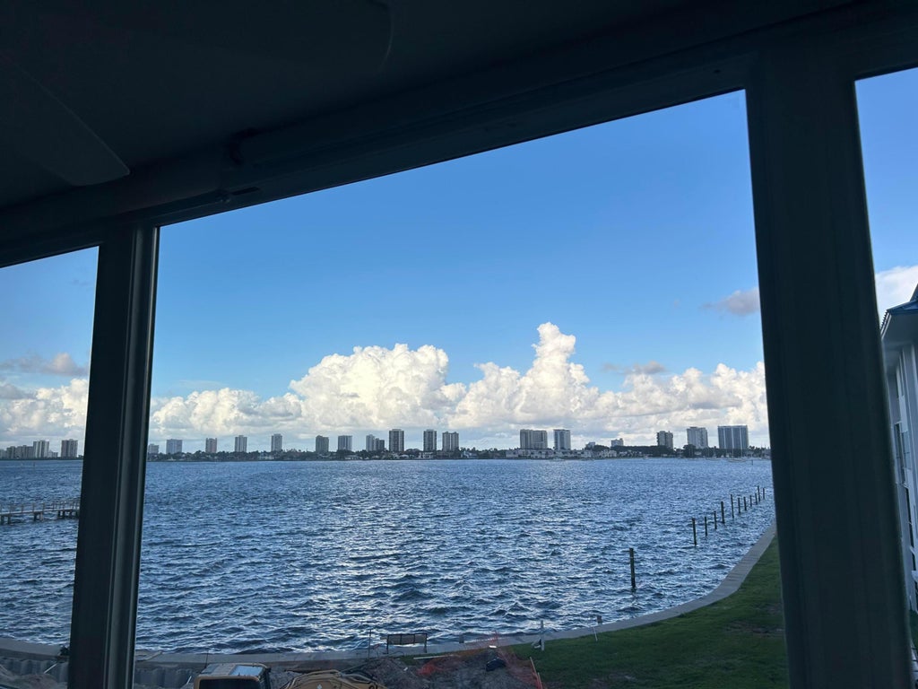 Photo of 2936 LAKE SHORE Drive #309, Riviera Beach, FL 33404 (MLS # B26077635)