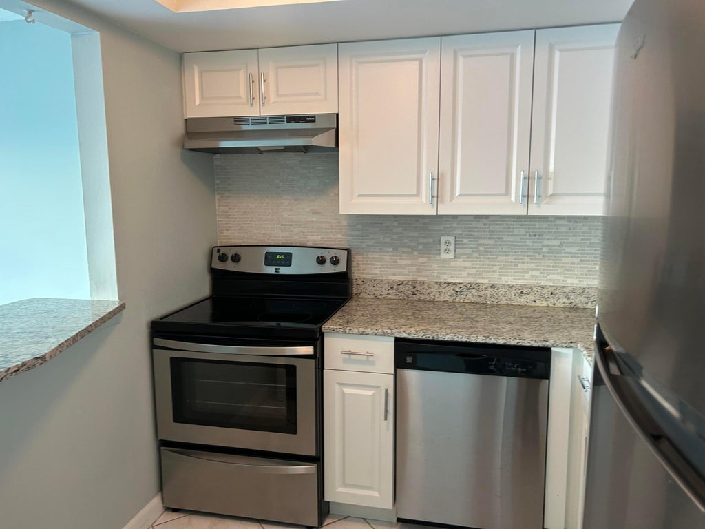 Photo of 2936 LAKE SHORE Drive #309, Riviera Beach, FL 33404 (MLS # B26077635)