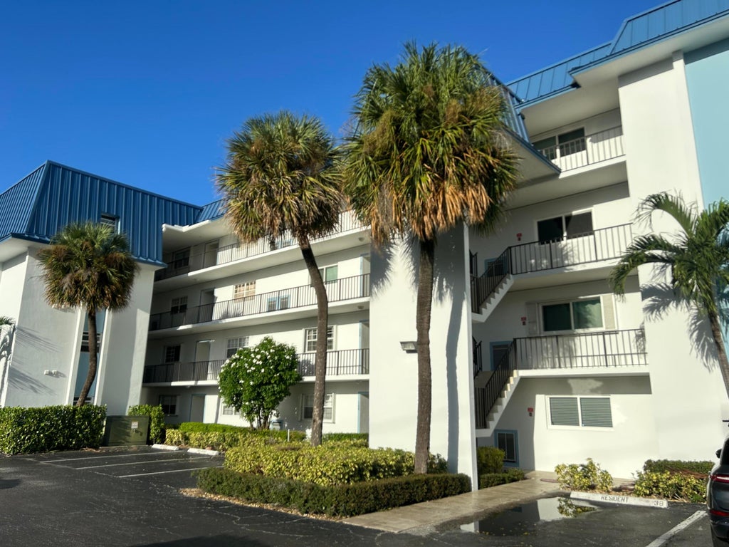 Photo of 2936 LAKE SHORE Drive #309, Riviera Beach, FL 33404 (MLS # B26077635)