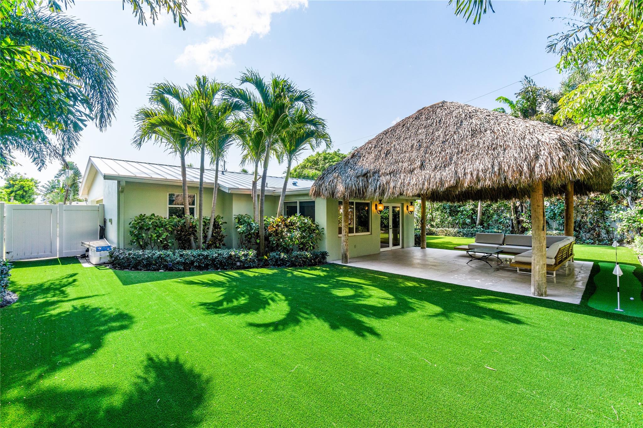 3 bedroom/2 bathroom home in the Cove area of Deerfield Beach available now for annual rent! With amazing curb appeal in the front and a private backyard oasis with Tiki Hut in the back this home is a 10! Updated kitchen and bathrooms, wood look tile floors throughout, laundry room off the kitchen and Florida room overlooking the backyard. Full impact windows and doors, fenced in yard with turf and extra shed for storage, and massive Tiki hut with TV hook up and putting green for backyard fun! Pets welcome with non-refundable fee. All tenants subject to background and credit check, 1st, last and security deposit required for move in.