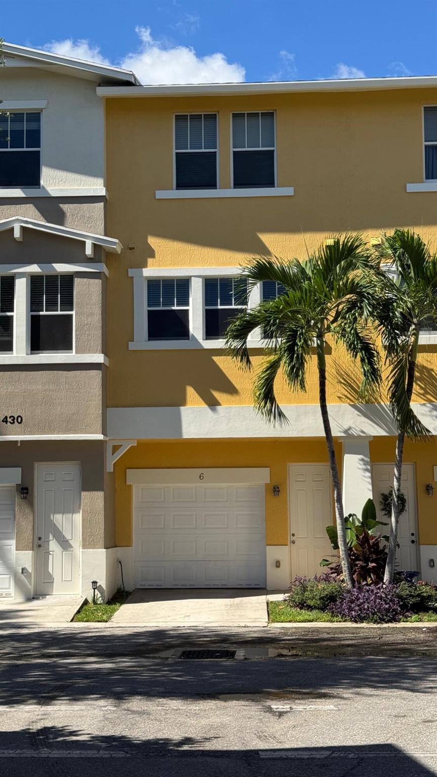 Beautifully upgraded 3-bedroom, 2.5-bath townhouse in the desirable gated community of Cityside. This quiet corner unit offers a spacious 1-car garage with built-in storage plus additional community parking. Features include fresh paint, luxury vinyl plank flooring, a large open kitchen with ample cabinetry, stainless steel appliances, and a Reverse Osmosis water system. Enjoy a new in-unit washer/dryer and water heater, 9-foot ceilings, abundant natural light, and ceiling fans in every room. Cityside offers resort-style amenities: a large pool, state-of-the-art gym, upscale clubhouse, movie theater, and walking trails. Prime location near PBI Airport, pristine beaches, downtown West Palm, Tanger Outlets, and world-class dining and shopping.