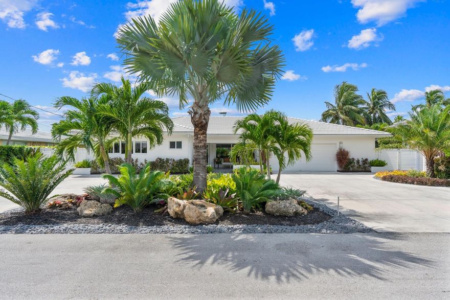 We Are Honored To Present A Stunning Contemporary Residence, Meticulously Maintained With Jaw-Dropping Detail & Elegant Design. Indulge Yourself In This Serene Sanctuary, The Perfect Escape For Life Off The Grid. Seamless Indoor/Outdoor w/ An Entire Full Wall of Windows, Invites The Richness Of A Private Back Yard Escape  Unplug, Enjoy A Quiet Conversation, Or Entertain Family & Friends With Ease. The Home Was Completely Renovated Down To The Studs In 2014. Open Floor Plan Includes More Than A Kitchen, & With A Forever Island. Updates Include: Saltwtr Pool, Diamond Brite, New Seawall Cap + 80’ Composite Dock, Impact Windows & Doors, Electrical Panel & Wiring, PVC Sewer Lines, New Roof & Trusses, All New A/C System Incl Ductwork, 12k lb. Boat Lift. Live Brilliantly, Right Here, Right Now...