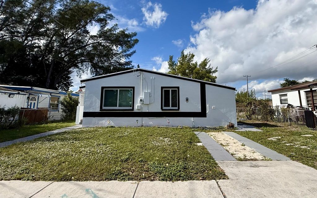 Photo of 5909 Pinewood Avenue, West Palm Beach, FL 33407 (MLS # R11146986)