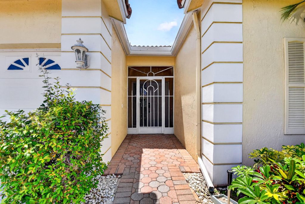 Photo of 9595 Orchid Grove Trail, Boynton Beach, FL 33437 (MLS # B26012985)