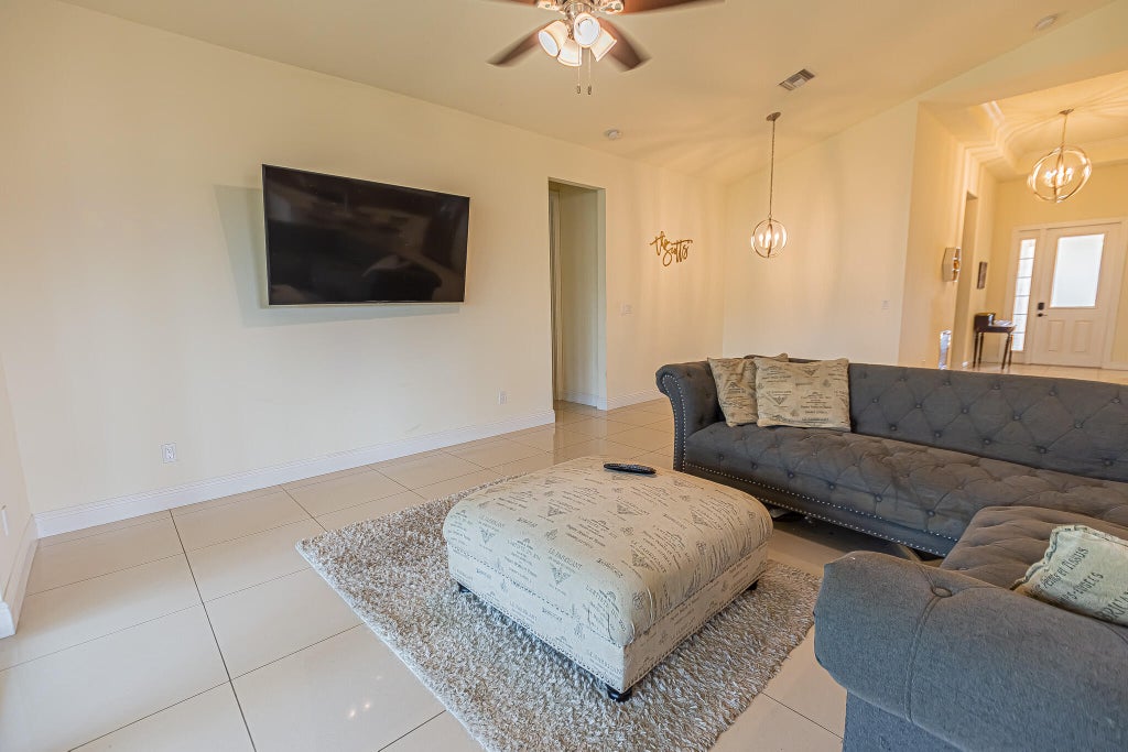 Photo of 930 SW Versailles Avenue, Port Saint Lucie, FL 34953 (MLS # B26011678)