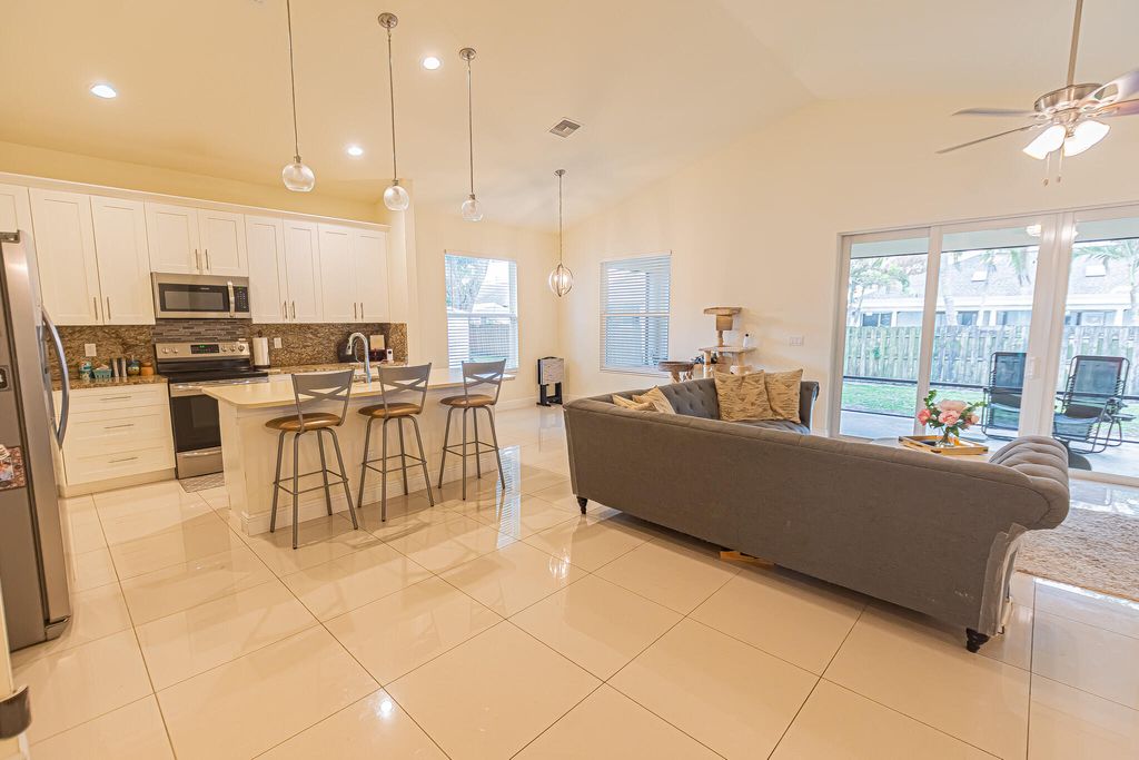 Photo of 930 SW Versailles Avenue, Port Saint Lucie, FL 34953 (MLS # B26011678)