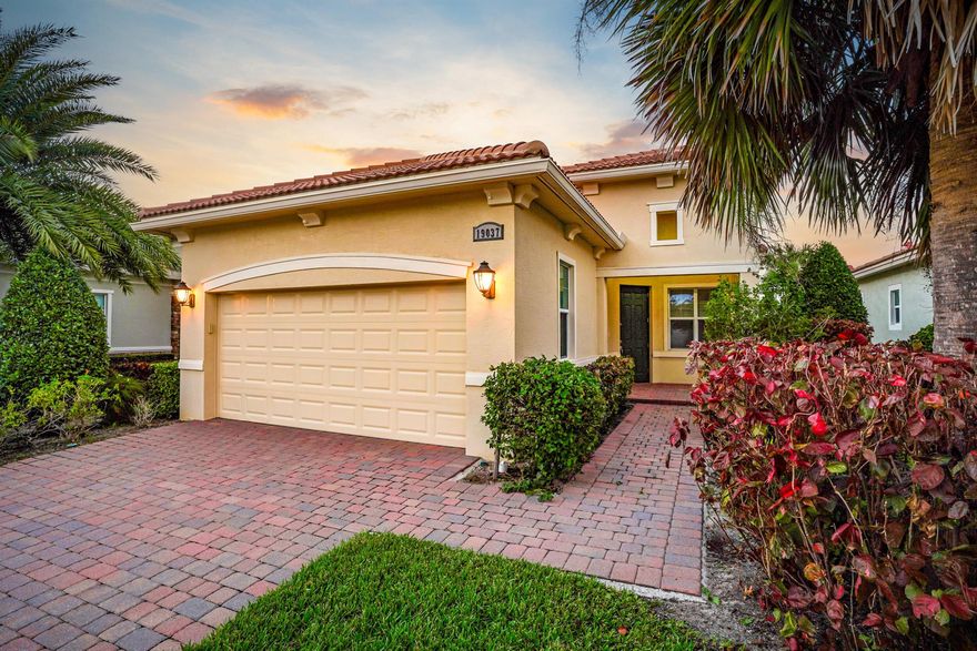 Discover the elegance of this beautifully maintained home featuring 2 spacious bedrooms , Den & 2 baths. The eat-in kitchen offers serene lake views, complete with premium upgrades like stainless steel appliances, 42'' wood cabinets, granite countertops, and a designer backsplash. Enjoy peace of mind in this safe gated community.

The home's living area is fully tiled, while the bedrooms are carpeted for added comfort. The living room and master suite feature tray ceilings, and the master suite includes dual closets, double vanities, and a walk-in shower. Modern lighting, added hi-hat lights, five ceiling fans, and storm-ready impact glass windows and doors enhance the home's appeal.

Step out to the screened patio with a charming lake view, and benefit from a large two-car garage.