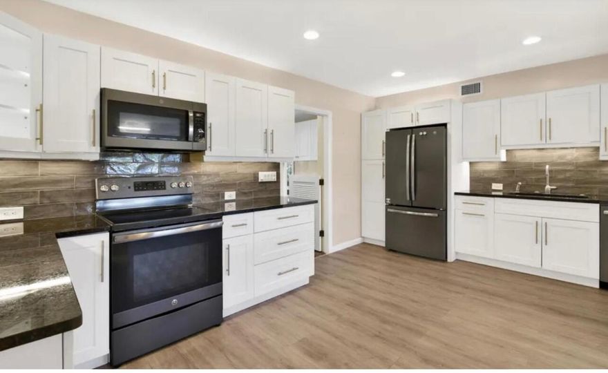 Rare opportunity to own a meticulously renovated single-family home with NO HOA on an oversized lot just minutes from the beach, marinas, & the iconic Key Lime House. Multiple driveways & parking pads provide room for RVs, boats, or trailers. The large fenced-in backyard offers room for a pool, avocado/coconut/mango trees, firepit, playset, storage shed, outdoor shower & custom lighting. Entertain in the enormous screened-in patio with sink, insulated ceiling, new fans, & a full-size refrigerator, plus an open-air patio perfect for a summer kitchen. Inside features open-concept living & a stunning white shaker kitchen with granite, stainless steel appliances, & cabinet lighting. Upgrades include: brand-new plumbing (1 year), new roof, hurricane impact windows/doors, newer AC, tankless... Upgrades include: brand-new plumbing (1 year), new roof, hurricane impact windows/doors, newer AC, tankless water heater, new insulation, updated electric, new stucco, fresh paint & new appliances. Perfect for an end user seeking the ultimate Florida lifestyle or an investor looking for prime lease potential. Act fastthis one will not last!