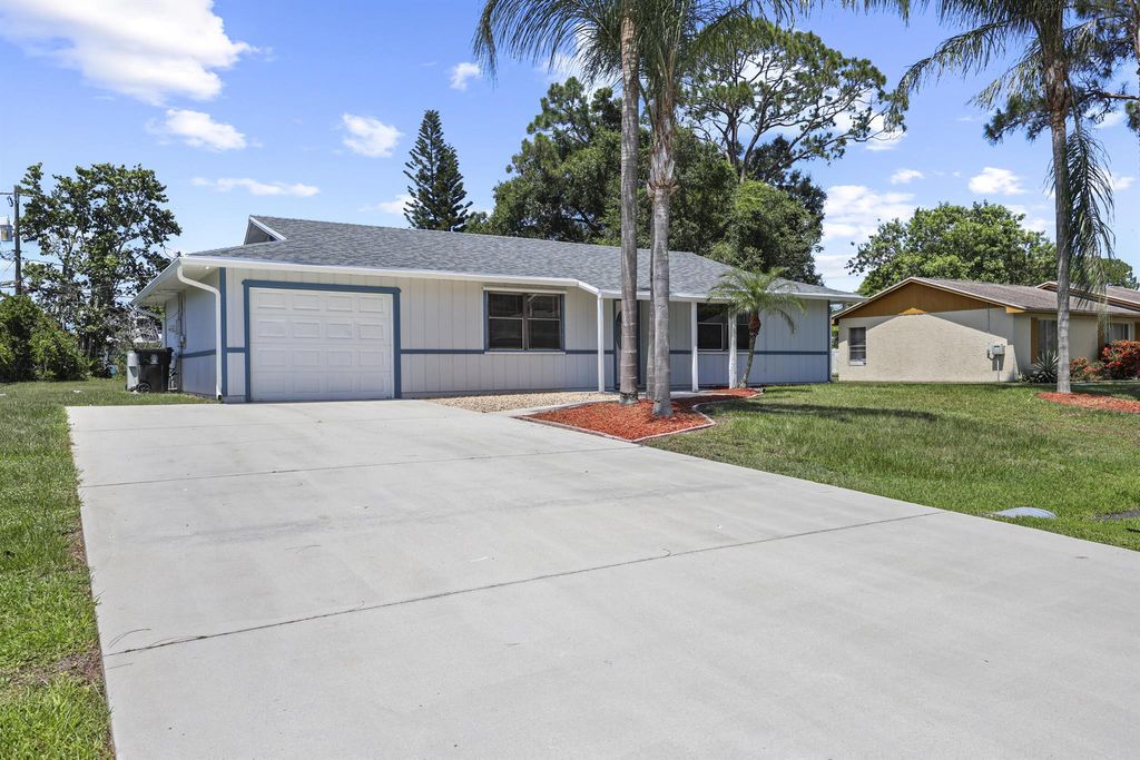 Photo of 1049 SW Eureka Avenue, Port Saint Lucie, FL 34953 (MLS # R11096790)