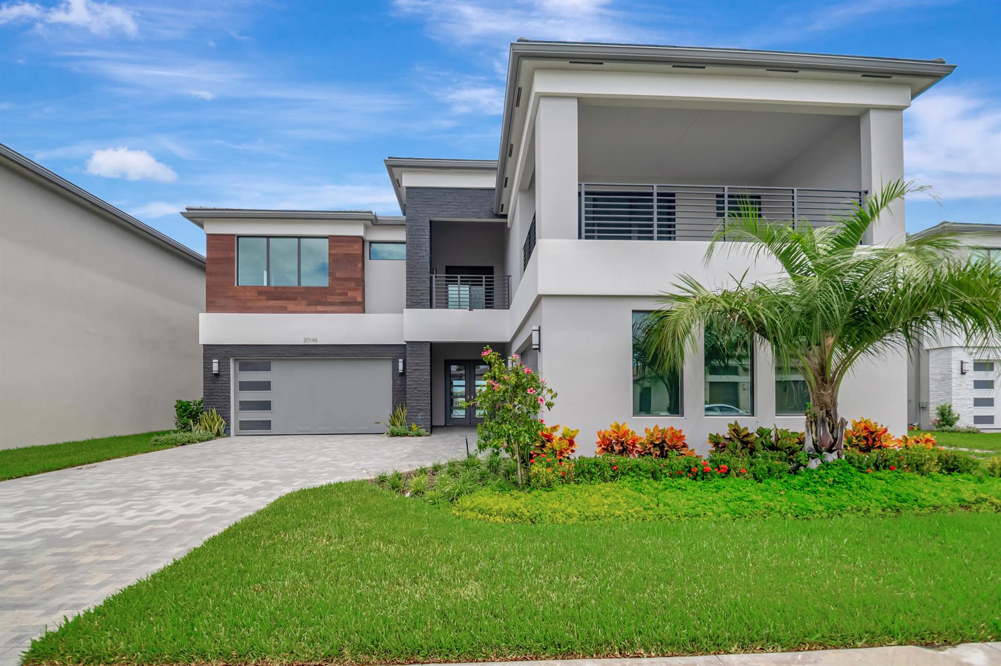Welcome to the exclusive Lotus Palm community. Experience luxury living at its finest! This is your opportunity to reside in the LAKE FRONT MALDIVES model, offering 5 bedrooms, 5 full baths, 2 half baths, a Media Room, Club Room, Loft, Game Room, and an expansive 4-Car Garage--this home is packed with everything you've been dreaming of and more. Designed with elegance in mind, the property features stunning upgrades including sleek porcelain flooring, designer bathrooms with custom finishes, built-in closets, high-end light fixtures, and blinds. The first floor boasts an OPEN FLOOR PLAN highlighted by a GOURMET CHEF'S KITCHEN with custom cabinetry and a breakfast area flowing into a spacious family room--perfect for hosting gatherings. The main level also includes a sophisticated