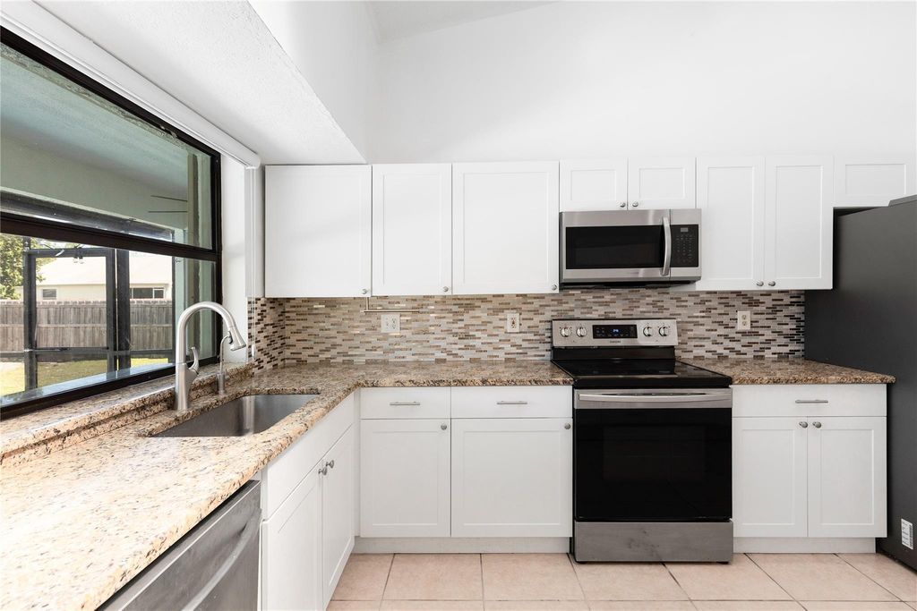 Photo of 2451 SE Shell Ave, Port St Lucie, FL 34952 (MLS # F10492070)