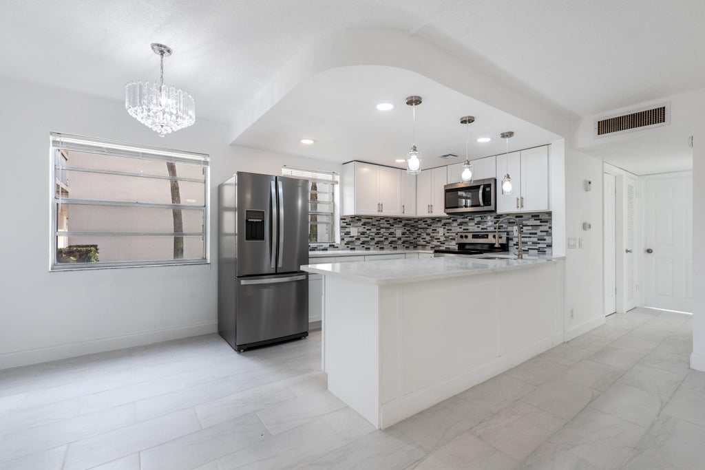 Photo of 108 Normandy C Lane, Delray Beach, FL 33484 (MLS # B26072611)