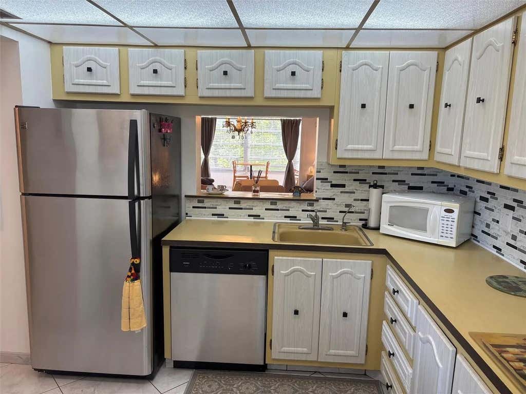 Photo of 4050 NW 42ND Avenue #415, Lauderdale Lakes, FL 33319 (MLS # B26063547)