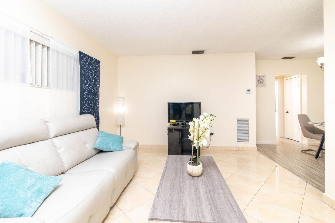 This charming 1 bed 1 bath Apt offers a perfect blend of comfort and convenience nestled close t St. Rd 7 and many shopping centers. This residence boasts a spacious living room and dining area and fully equipped kitchen. This unit has two parking spaces dedicated for this unit. Unit is updated with Central A/C Unit and safe with Secured cameras around the complex. There is also an open backyard for tenant use.