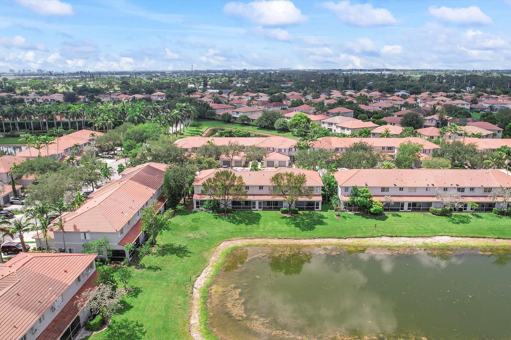 ****Seller paying 3 month HOA Dues at Closing! **** Look no further--this beautifully maintained 2-bedroom, 2.5-bath townhome in the highly sought-after gated community of Turtle Cay is exactly what you've been searching for. From the moment you arrive, you're welcomed by a charming covered entrance that leads into a spacious and open floor plan, ideal for both relaxing and entertaining. The main living and dining areas are open and inviting, flowing seamlessly into the kitchen, which features ample cabinetry, a brand-new stainless steel stove and refrigerator, and access to the private screened-in and tiled back porch. Large sliding glass doors from both the kitchen and living room invite natural light and lead to serene lake views, making indoor-outdoor living a breeze.