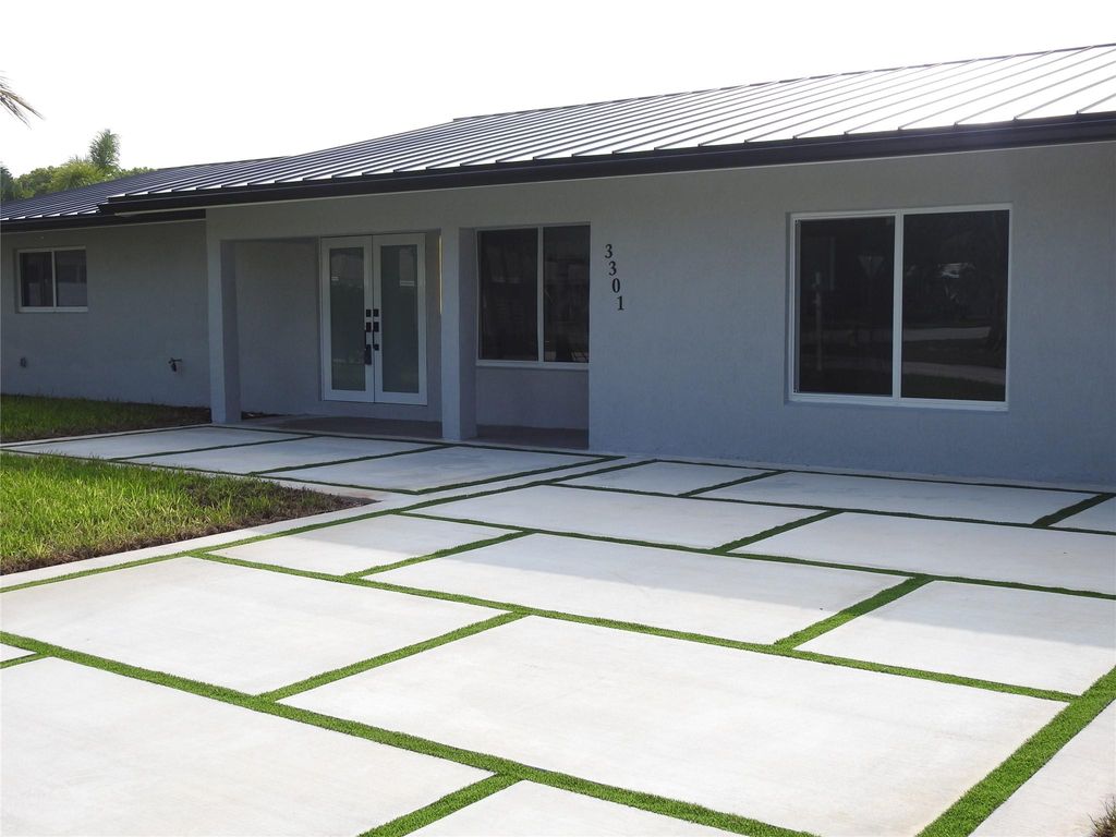 Photo of 3301 NE 18th Terrace, Oakland Park, FL 33306 (MLS # F10403478)