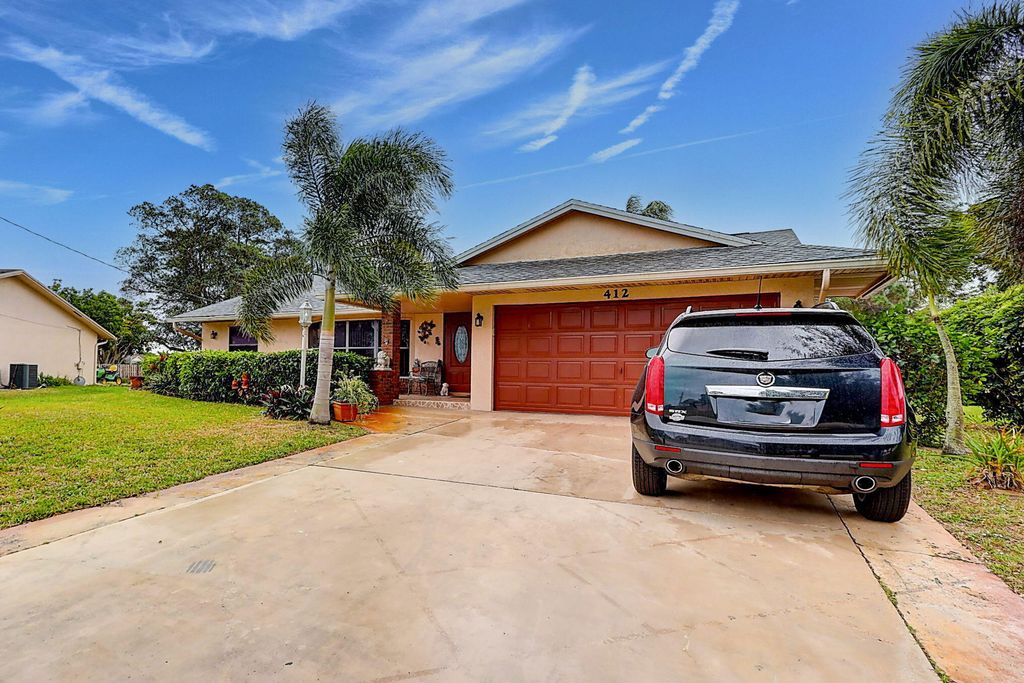 Photo of 412 SW Sansom Lane, Port Saint Lucie, FL 34953 (MLS # R10943497)