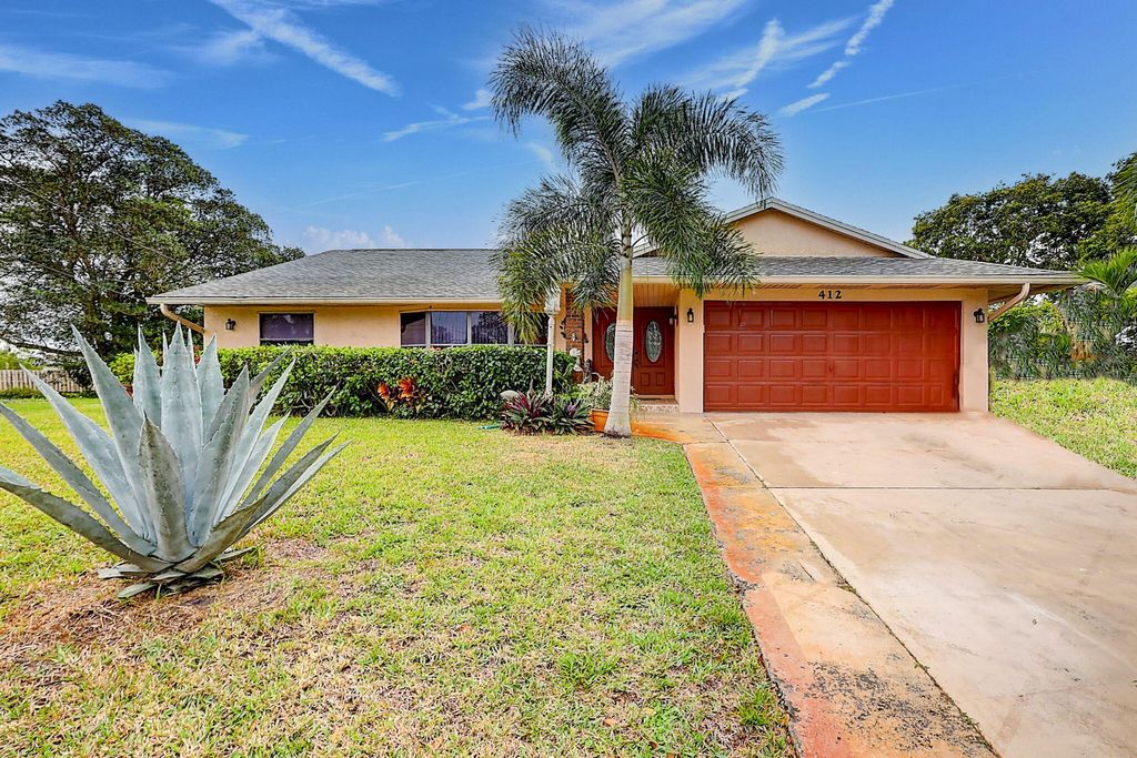 Photo of 412 SW Sansom Lane, Port Saint Lucie, FL 34953 (MLS # R10943497)