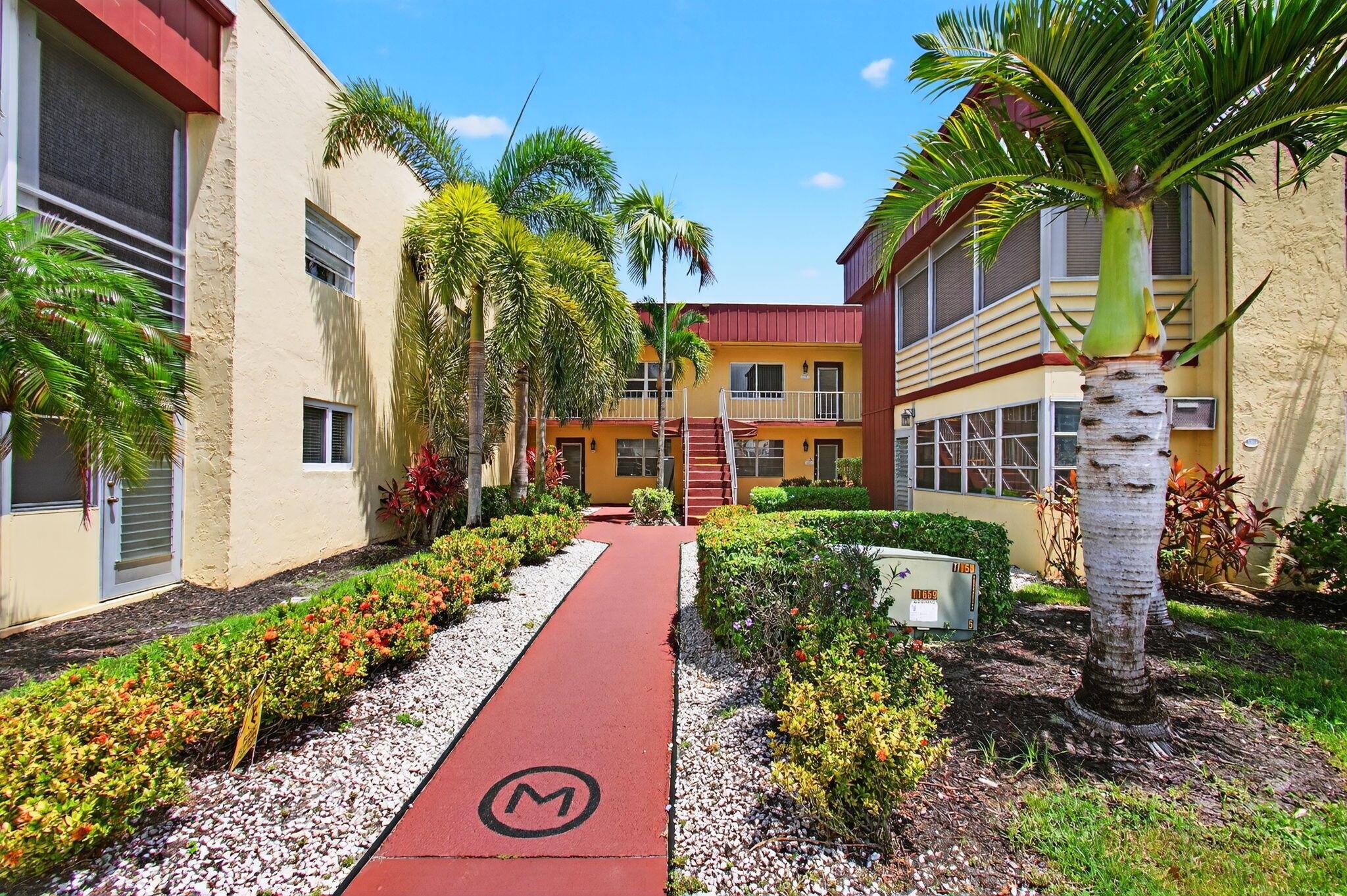 Embrace the captivating charm and modern convenience of this second-floor unit situated in the prestigious 55+ Kings Point Golf and Country Club. Perched majestically amidst the verdant expanse of a well-maintained golf course, this Flanders M Model invites you to revel in undisturbed views and invigorating Florida breezes from the comfort of your living room.Solid CBS construction ensures sturdiness and longevity that pairs seamlessly with the contemporary aesthetics of the interior. As you step inside, you'll immediately notice the warmth of bristling laminate flooring underfoot, harmonizing with the updated design of the kitchen. Modern appliances, recent A/C (2021) and water heater (2023), only serve to complement the unit's ambiance of convenience and comfort.