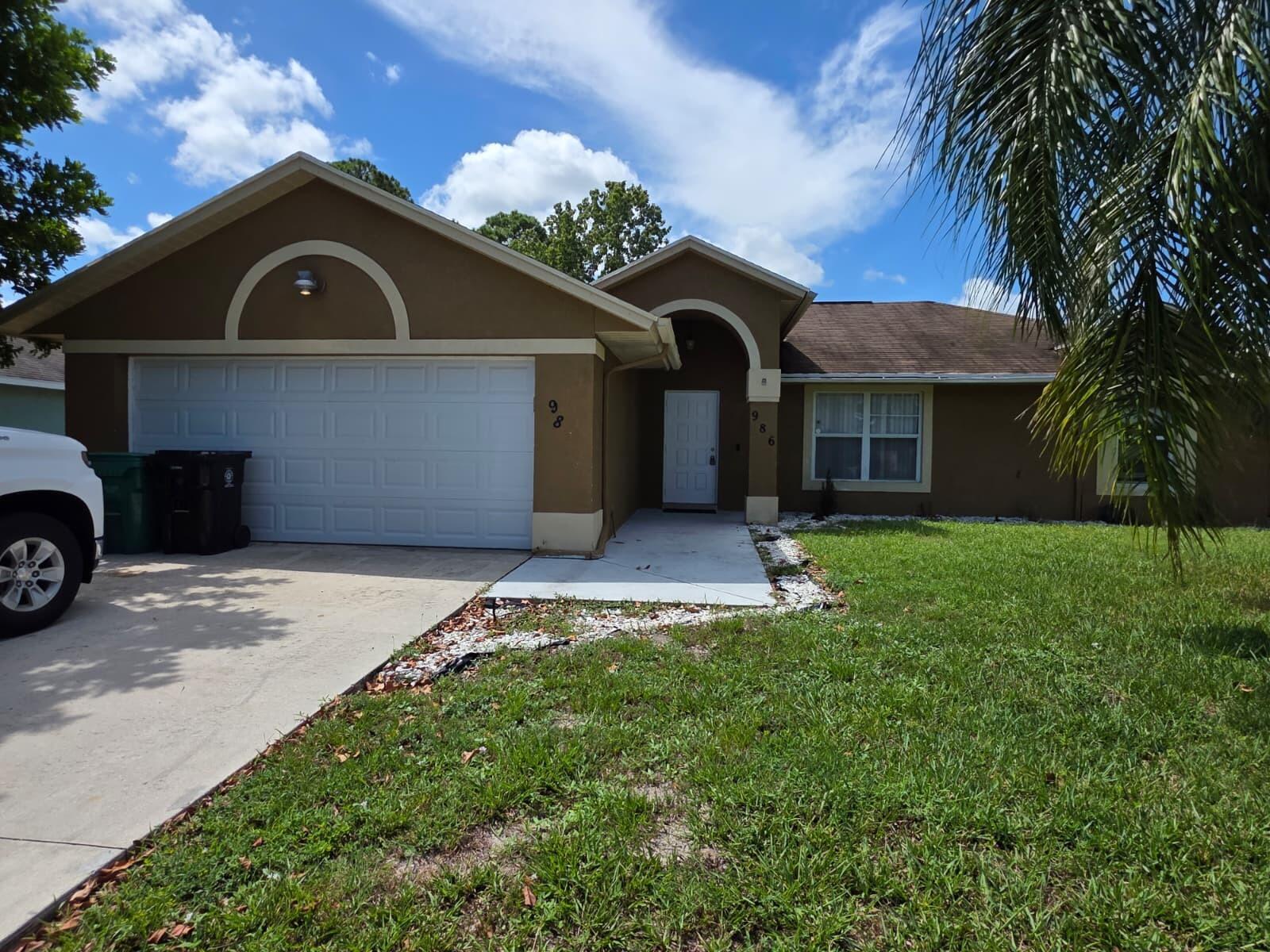 Freshly painted and ready for immediate occupancy, this charming 3-bedroom, 2-bathroom home. Conveniently located just off Port Saint Lucie Blvd and minutes from I-95, you'll enjoy easy access to shopping, dining, and everything the area has to offer.Step outside and take in the spacious yard--perfect for relaxing.