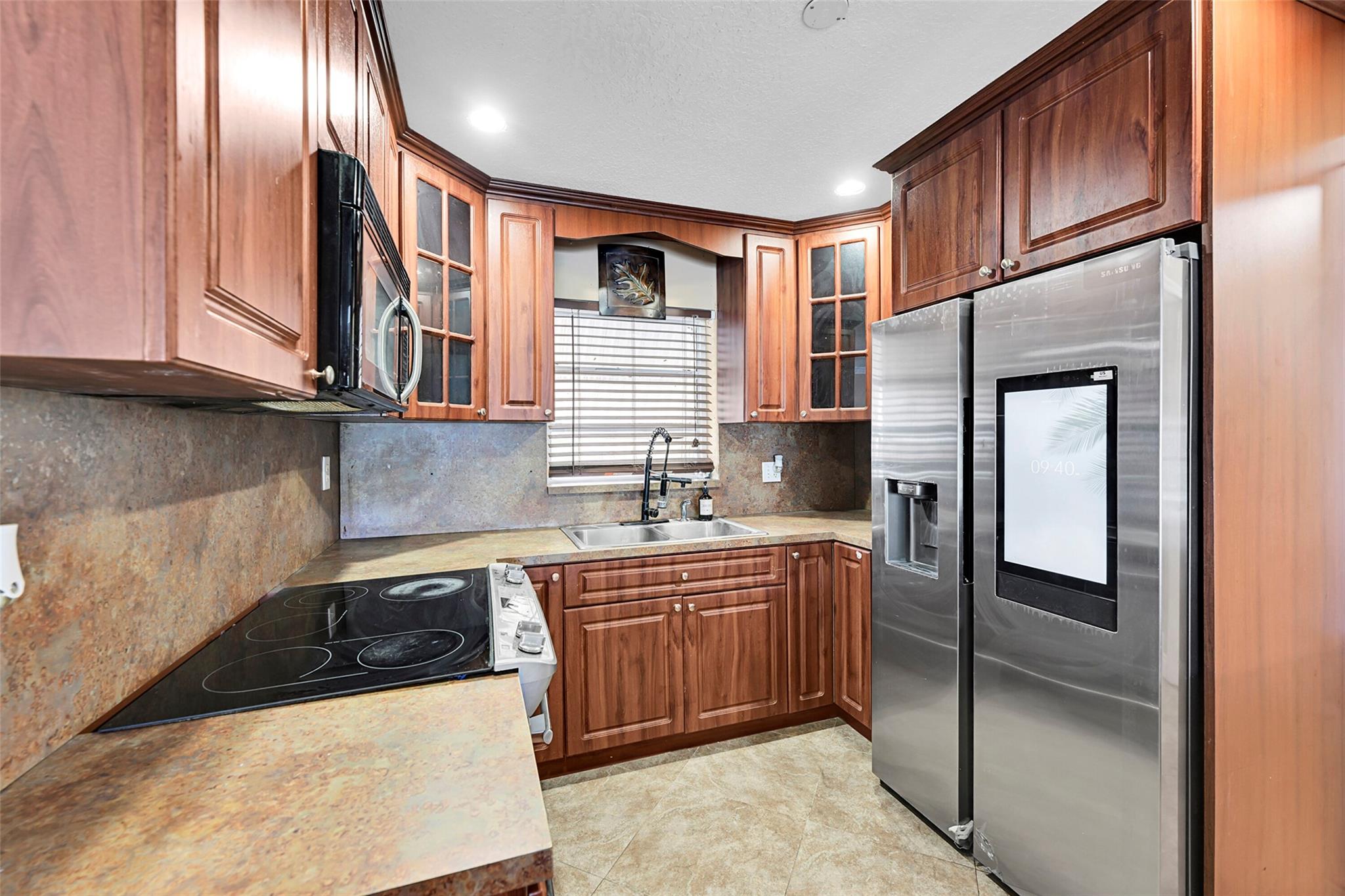 All ages and bring your first time FHA buyers. With rates at 5.75 why wouldn't you buy this home? Fall in love with this beautifully remodeled 3-bedroom, 2-bath home in the heart of Pompano Beach! Featuring a stylish new kitchen with real wood cabinets and stainless steel appliances, no carpet throughout, and a spacious layout. The third bedroom has its own private entrance—ideal for an in-law suite or Airbnb! Located just minutes from I-95, the beach, Lighthouse Point, top-rated schools, and shopping. This is the one you've been waiting for—schedule your showing today. Located just minutes from I-95, the beach, Lighthouse Point, top-rated schools, supermarkets, and shopping. this one checks every box. Schedule your private tour today!