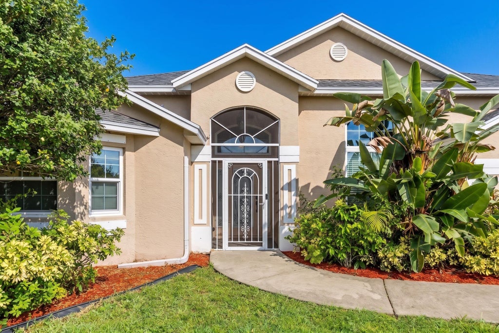 Photo of 301 SW Buzby Court, Port Saint Lucie, FL 34953 (MLS # B26045727)
