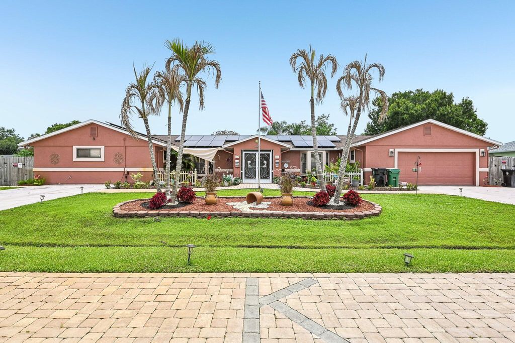 Photo of 2457 SW Mercer Street, Port Saint Lucie, FL 34984 (MLS # B26035459)