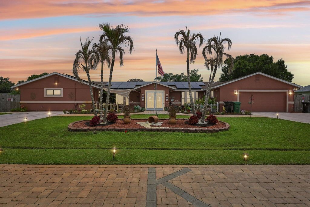 Photo of 2457 SW Mercer Street, Port Saint Lucie, FL 34984 (MLS # B26035459)