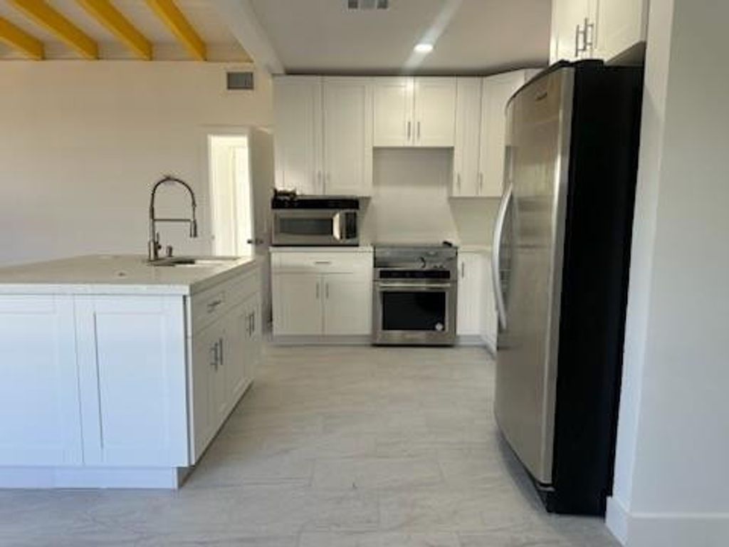 Photo of 821 N B Street, Lake Worth Beach, FL 33460 (MLS # F10538589)