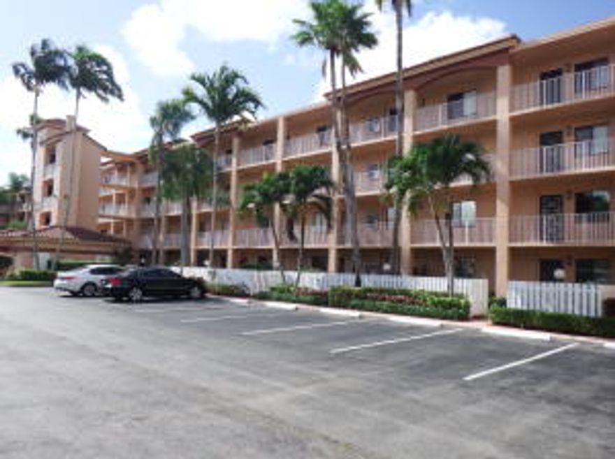 1st Floor, 2 bedroom plus den and gorgeous, long lake views in one of the most desirable active adult communities in West Delray Beach, Florida. Ideally located with an easy walk to the main clubhouse, cafe, tennis, indoor/out pools and active satellite pool. Easy to see but hurry you must own this condo by December 31, 2015 to homestead for 2016 property taxes. (See property appraiser site for additional requirements)  Board approval takes 30 days.  Maintenance is paid quarterly and includes water and cable tv.  No equity buy in to enjoy the clubhouse which has a huge theater.  Convenient parking spot with guest parking nearby and free additional storage in the building. Roll up Shutters on patio and patio is enclosed with glass sliding doors.