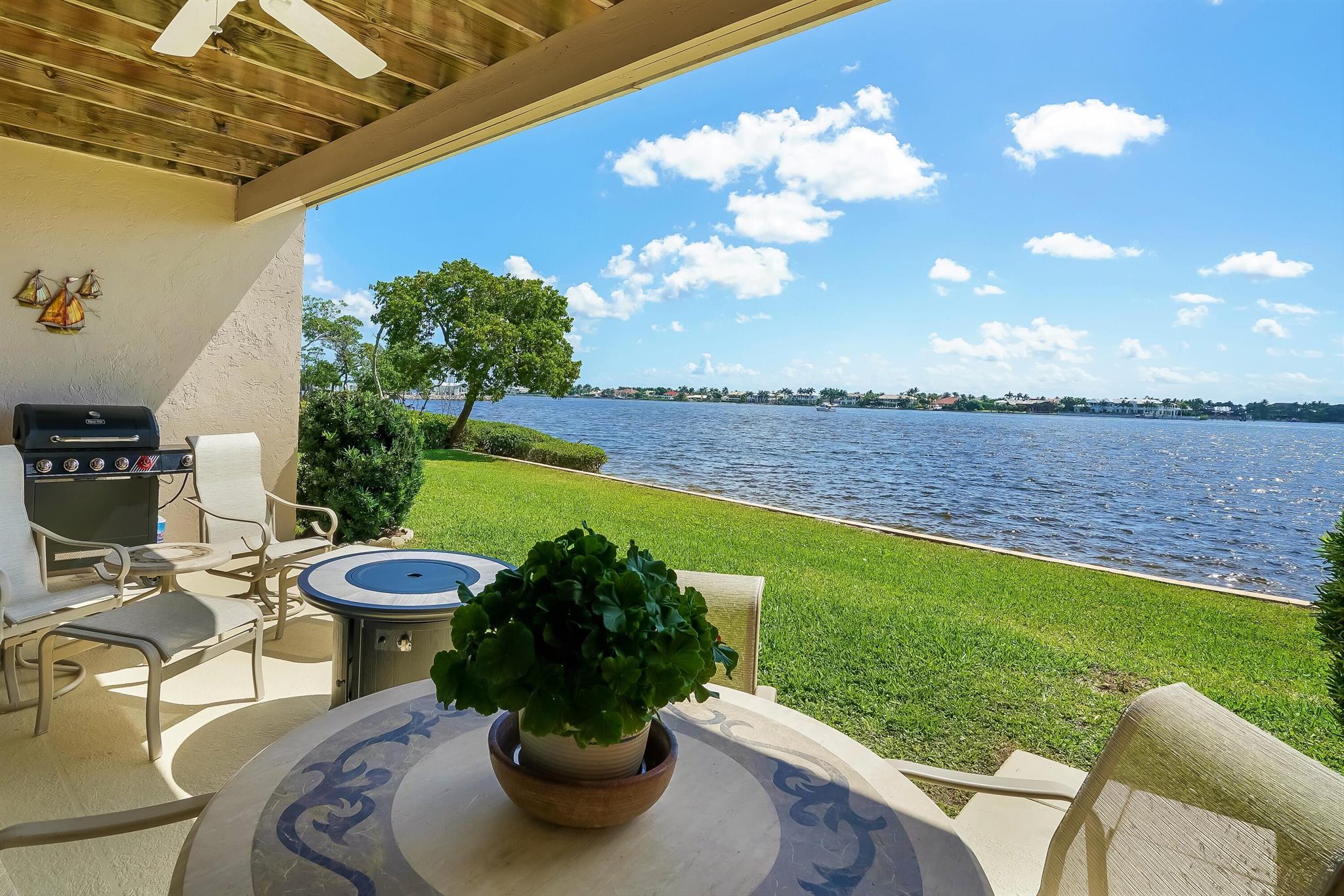 Direct waterfront townhouse with breathtaking views in pet friendly community! This 3 bed 2 and a half bath home is a boaters dream or perfect for anyone who loves to see the water. When you enter through the oversized foyer the first thing that you notice is the direct water views from every room on the ground floor thanks to the wall to wall hurricane impact doors in the living room overlooking the widest point of the Intracoastal waterway and point Manalapan which provides you with complete privacy and views in every direction. This townhouse has been completely renovated to include a much larger kitchen which features a well thought out new configuration, custom cabinetry, lighting, and appliances; a stunning master bath which is highlighted by a glass shower room, rainfall showerhead