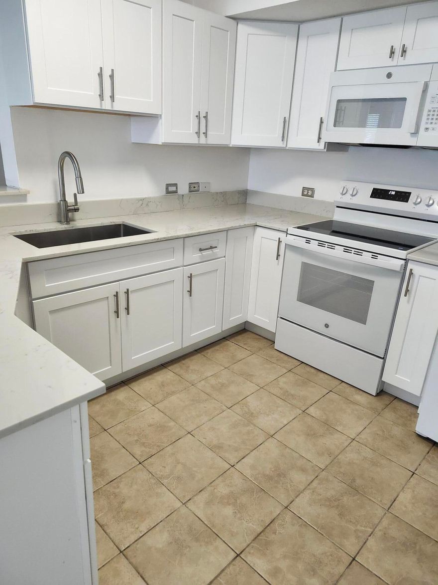 VERY NICE FIRST FLOOR THREE BEDROOM CONDO IN RESORT STYLE COMMUNITY. NEW WHITE SHAKER CABINETS, QUARTZ  COUNTER TOPS, NEW MICROWAVE AND STOVE.  BOTH BATHROOMS UPDATED. IMPACT GLASS WINDOWS.  FULL SIZE WASHER/DRYER. CLOSE TO BEACH, I-95, AND ATLANTIC AVE IN DELRAY. AMENITIES INCLUDE A GATED ENTRANCE, HEATED POOL JACUZZI, BILLIARDS, GYM, INDOOR BASKETBALL/RACQUETBALL COURT AND BBQ  AREA AT THE POOL. CABLE AND WATER INCLUDED IN THE RENT. TENANT MUST HAVE 700 CREDIT SCORE OR BETTER AND INCOME 3 TIMES THE MONTHLY RENT.