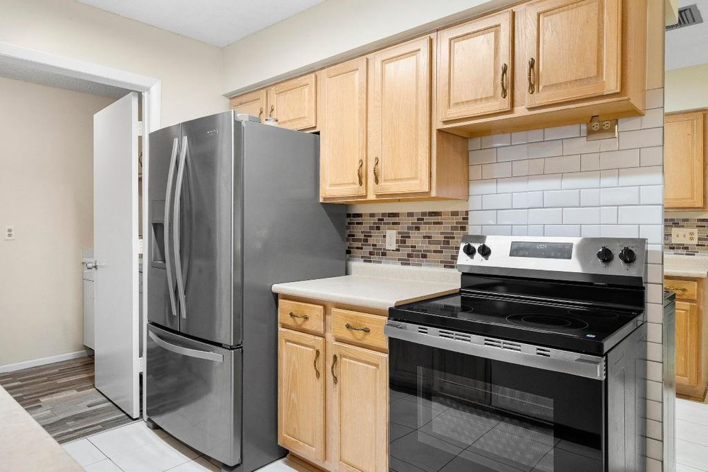 Photo of 4081 NW Cinnamon Tree Circle, Jensen Beach, FL 34957 (MLS # R11113705)