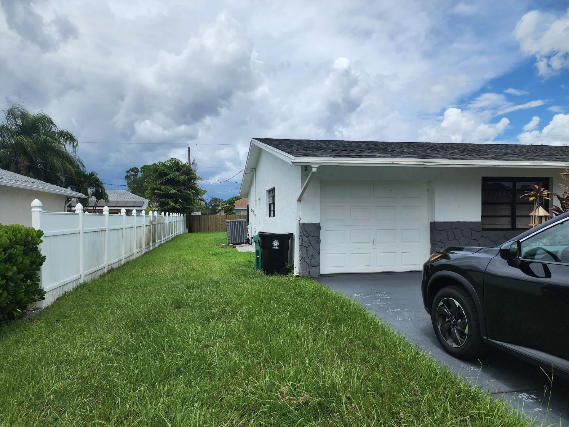 Step into this 3-bedroom, 2-bathroom POOL home, perfectly situated in the heart of Port St. Lucie. Whether you're looking for your home or a property with income-producing potential, this one has it all—including a partially converted garage ideal for an efficiency unit or mother-in-law suite. The home features crown molding, tile flooring, and a chef-inspired kitchen that boasts white shaker cabinets, stainless steel appliances, quartz countertops, a stunning tile backsplash, and a chic breakfast nook with a backlit accent wall and TV—perfect for casual dining or morning coffee.
Step outside to your private oasis! The screened patio and outdoor tiki bar overlook a sparkling pool, making this the ultimate home for entertaining, relaxing, or hosting unforgettable summer BBQs.