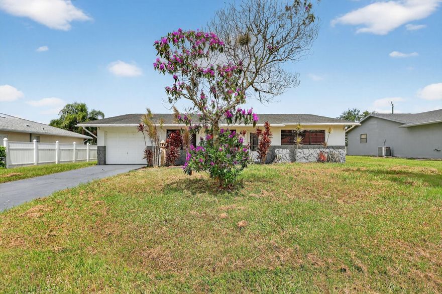 Step into this 3-bedroom, 2-bathroom POOL home, perfectly situated in the heart of Port St. Lucie. Whether you're looking for your home or a property with income-producing potential, this one has it all—including a partially converted garage ideal for an efficiency unit or mother-in-law suite. The home features crown molding,  tile flooring, and a chef-inspired kitchen that boasts white shaker cabinets, stainless steel appliances, quartz countertops, a stunning tile backsplash, and a chic breakfast nook with a backlit accent wall and TV—perfect for casual dining or morning coffee.
Step outside to your private oasis! The screened patio and outdoor tiki bar overlook a sparkling pool, making this the ultimate home for entertaining, relaxing, or hosting unforgettable summer BBQs.
