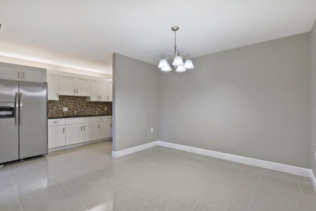 Photo of 3329 Gardens Drive E #Unit A, Palm Beach Gardens, FL 33410 (MLS # R11155392)