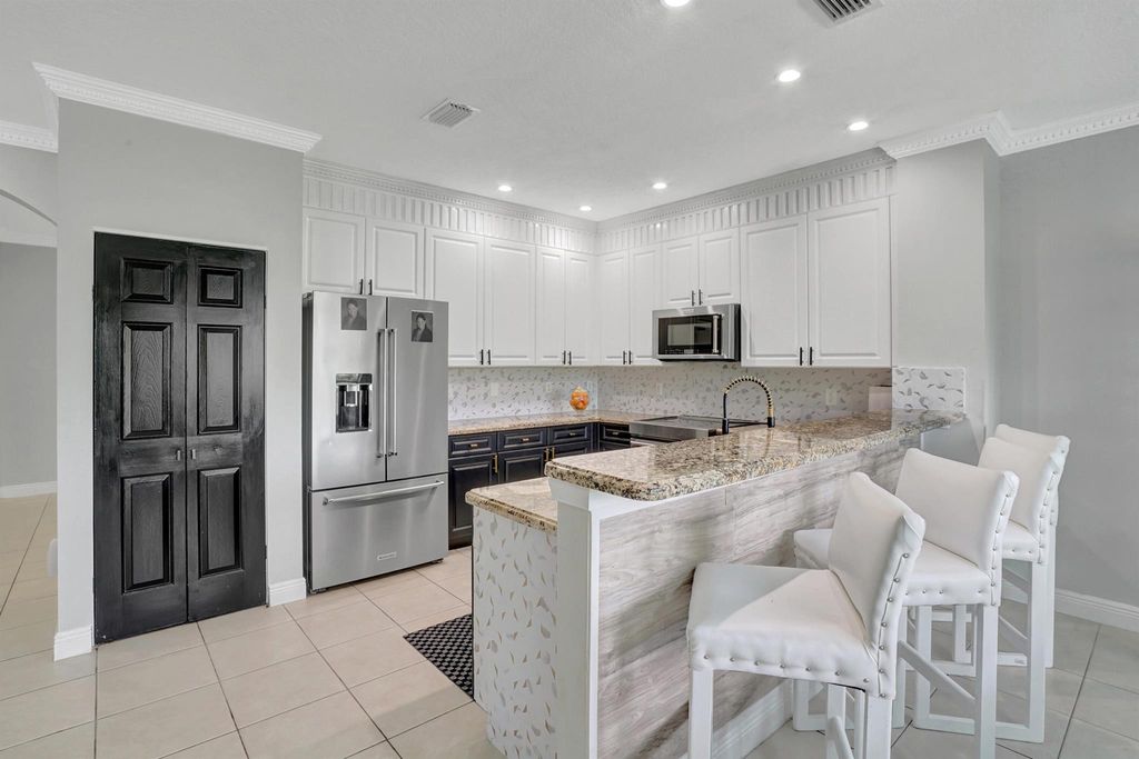 Photo of 6896 Lantern Key Drive, Lake Worth, FL 33463 (MLS # R10932346)