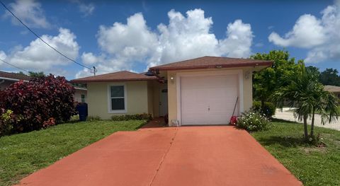 Photo of 1400 E Ac Evans Street, Riviera Beach, FL 33404 (MLS # R11116386)