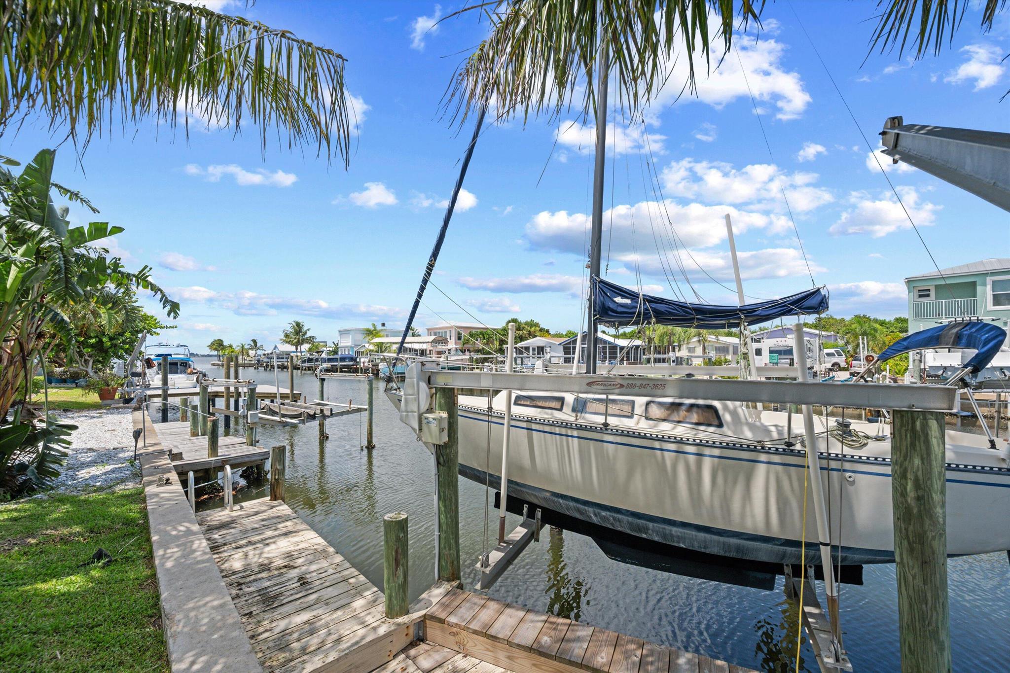 Discover this Waterfront Gem on Hutchinson Island! Fully Furnished, Turnkey and ready for your Enjoyment! 2 Bedrooms, 2 Bathrooms with Carport + Extra Parking & Direct River access for your Paddleboard / Jet-ski or 20' Boat (plus boat ramp a possibility). A Superb Location with Beach access available!! Peaceful Water Views & a walk out Open Patio - Perfect for Relaxation time or cooking out with Family & Friends. Everything is Included- Water, Lawn, WIFI/Cable & Electric ($150.00 Cap Monthly) PLUS Truck Friendly too!
