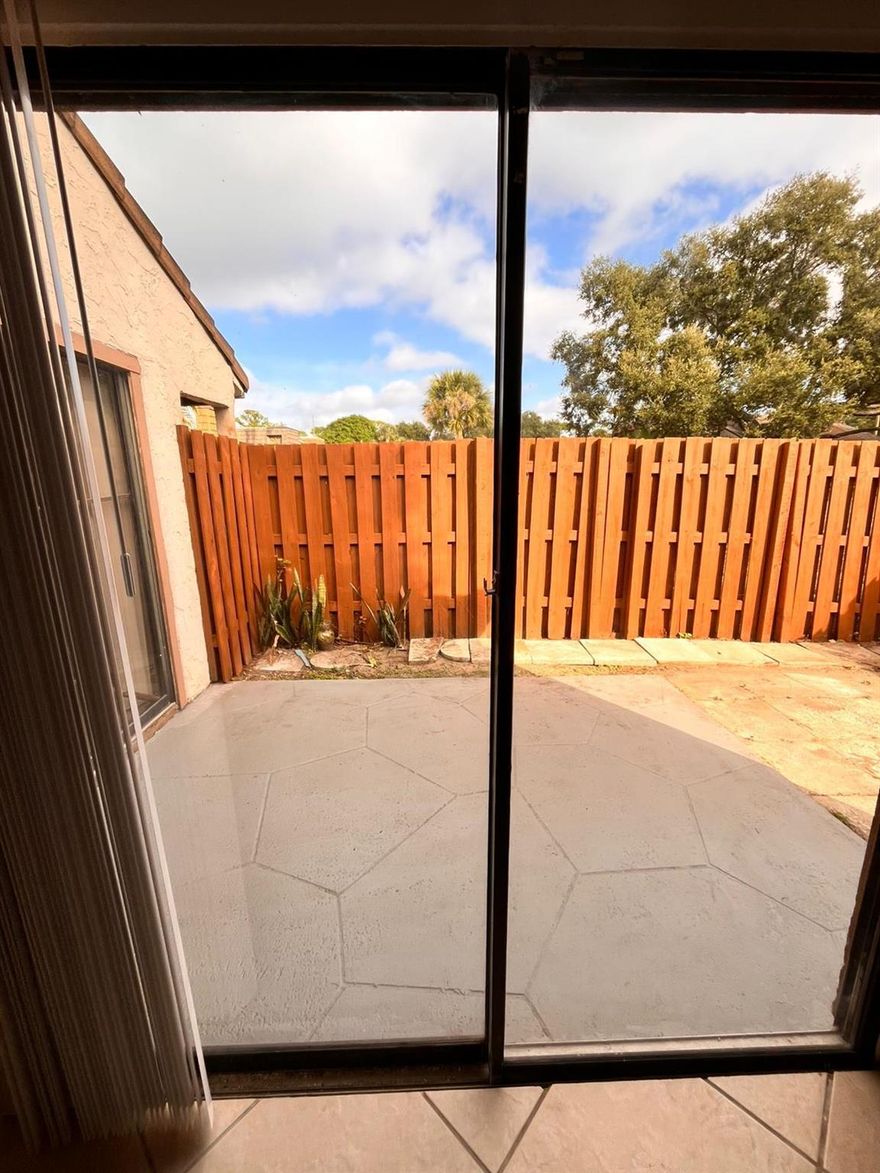 Bright, open townhouse with tall ceilings and loft.  Stainless steel appliances and washer and dryer. Main bedroom downstairs with 2nd bedroom upstairs off of the loft area. Private fenced area.